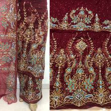 Load image into Gallery viewer, Radiant Maroon with Sky Blue Rhinestone Stone Beaded Net Lace George Wrapper Set with Blouse   - NLDG303